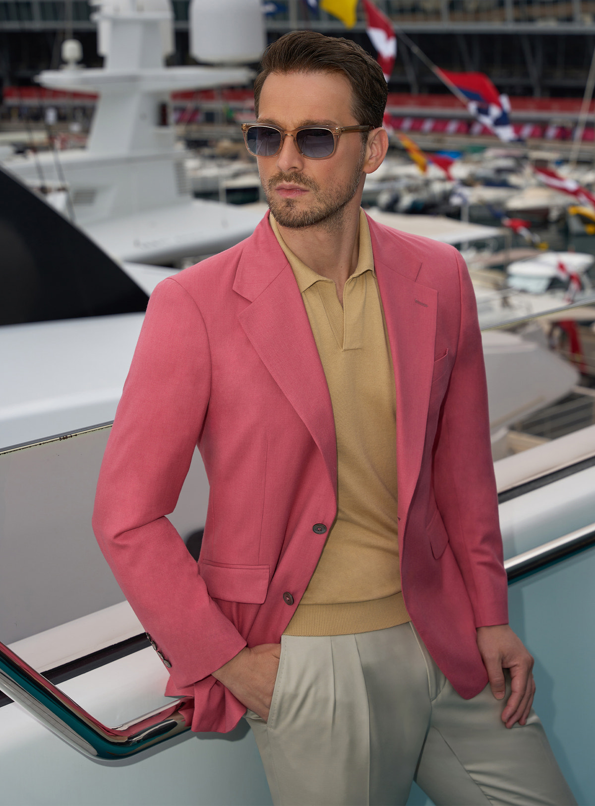 Pink Consiglieri jacket with an ochre polo shirt and light trousers