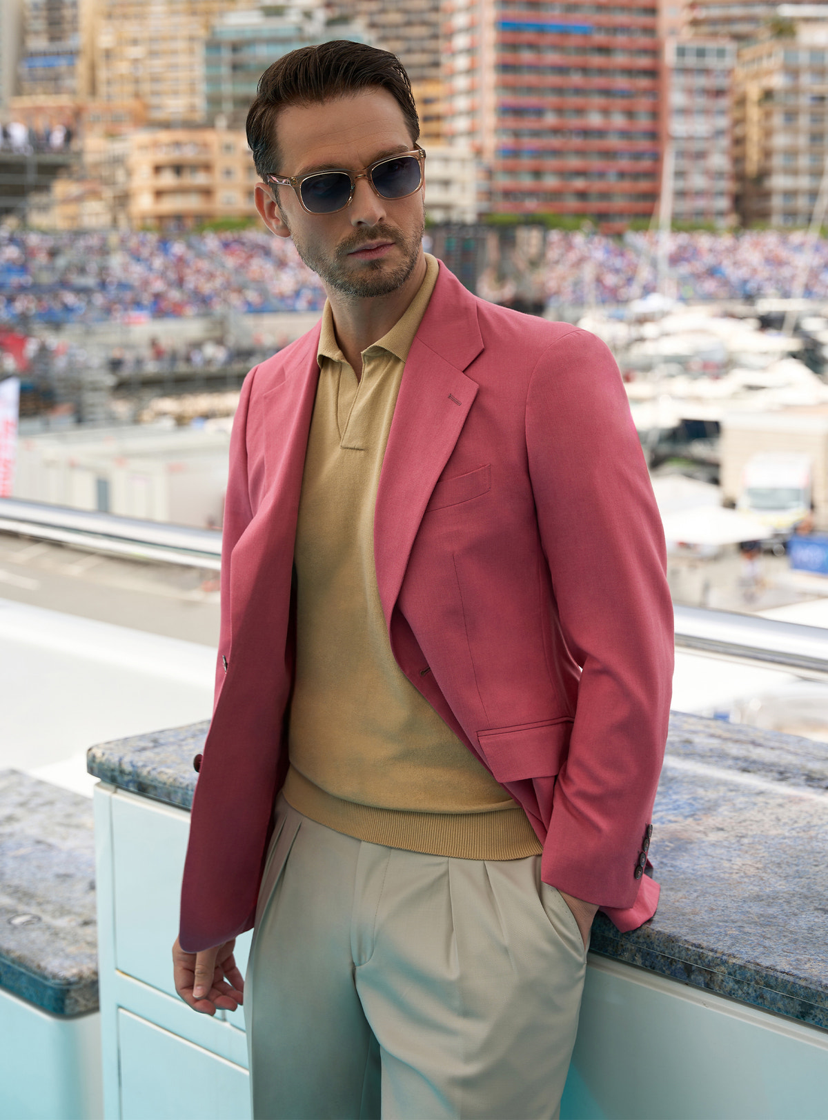 Pink Consiglieri jacket with an ochre polo shirt and light trousers