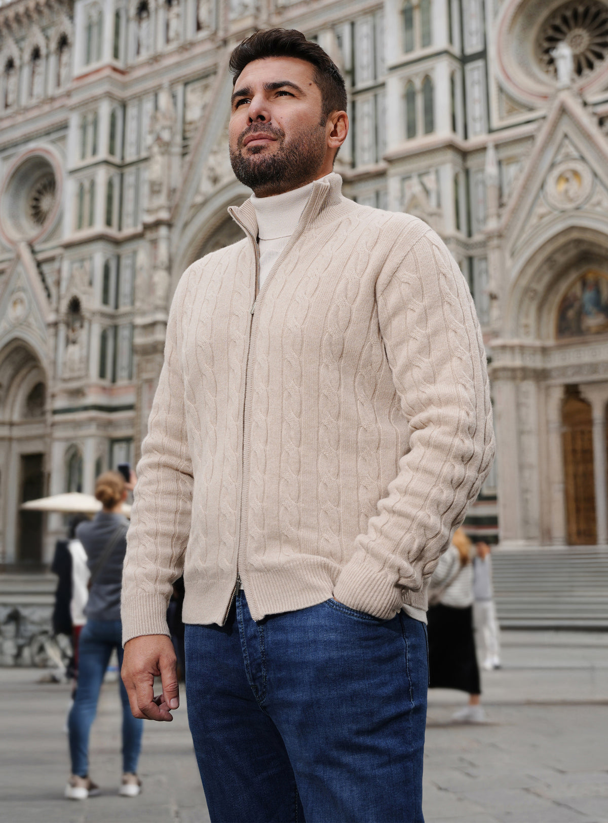 Cream cable-knit Consiglieri cardigan with blue jeans and brown loafers