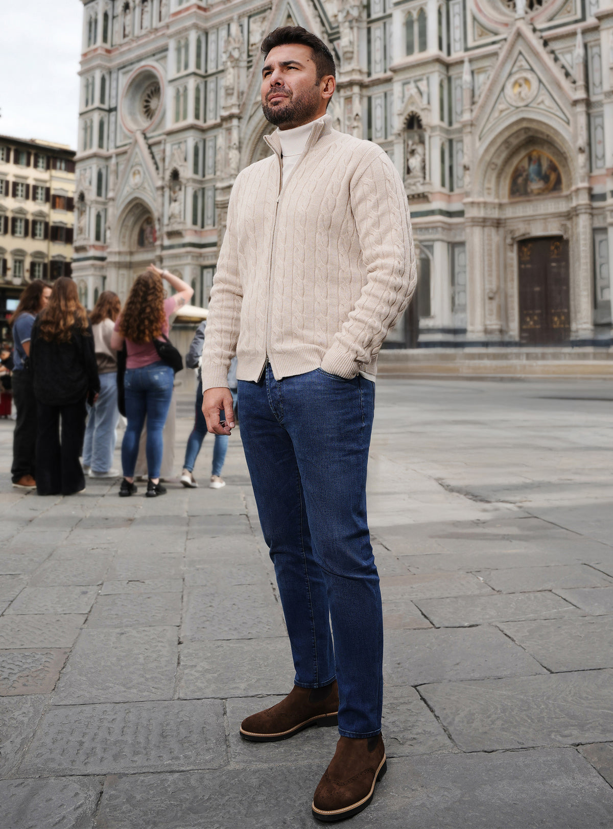 Cream cable-knit Consiglieri cardigan with blue jeans and brown loafers
