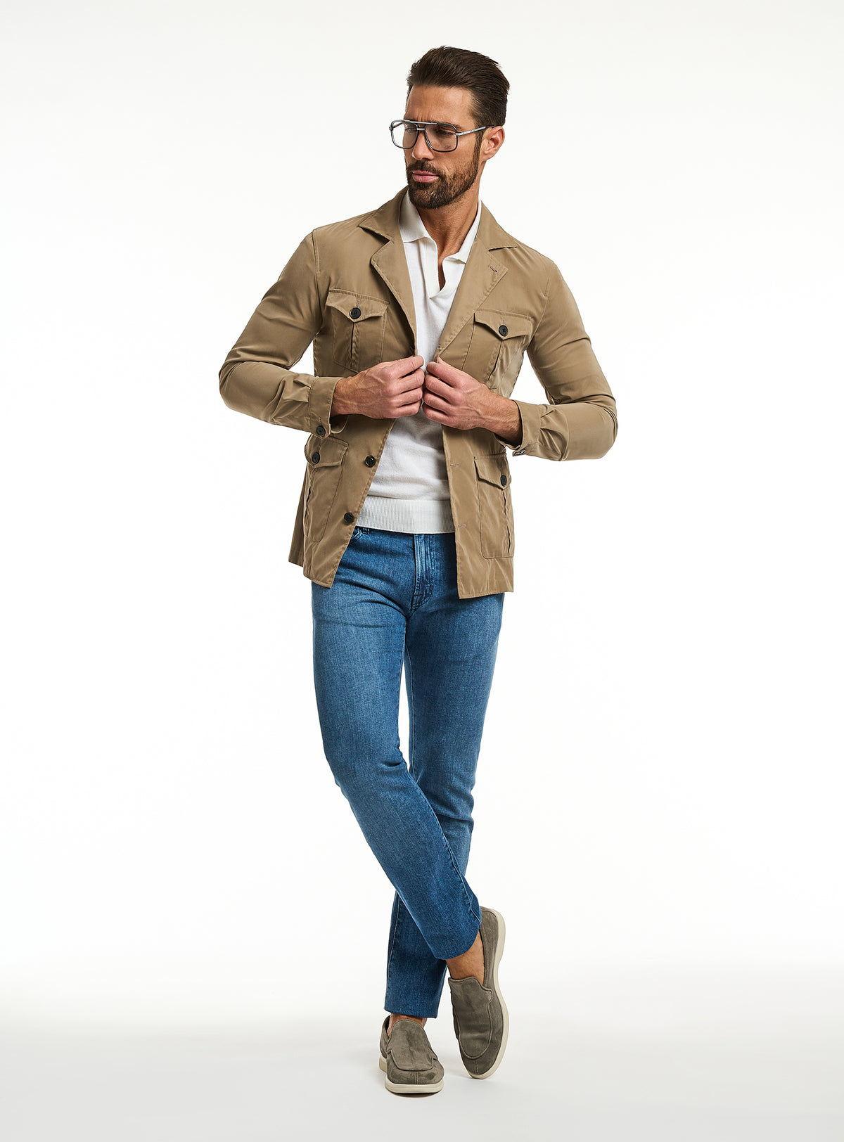 Consiglieri: blue jeans with a camel jacket and ivory polo