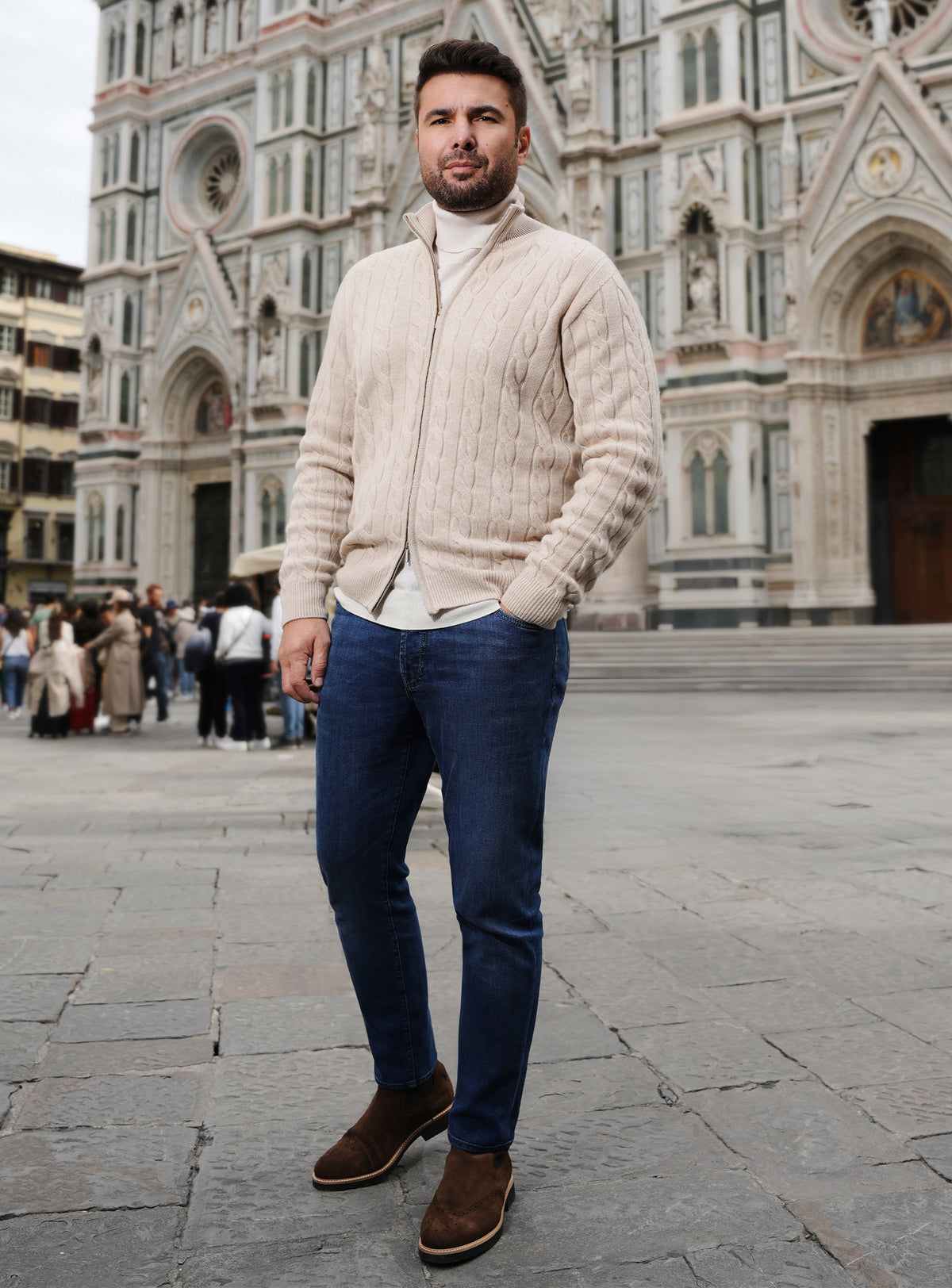 Cream cable-knit Consiglieri cardigan with blue jeans and brown loafers