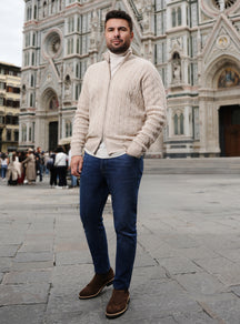 Cream cable-knit Consiglieri cardigan with blue jeans and brown loafers
