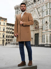 Camel Consiglieri overcoat with notch lapels, a white turtleneck and jeans