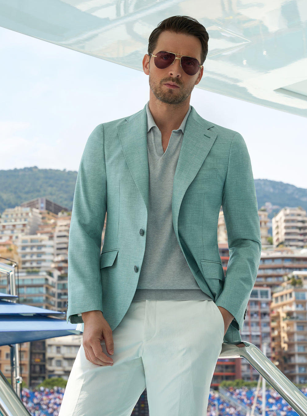 Mint green Consiglieri jacket with a light polo shirt and white trousers