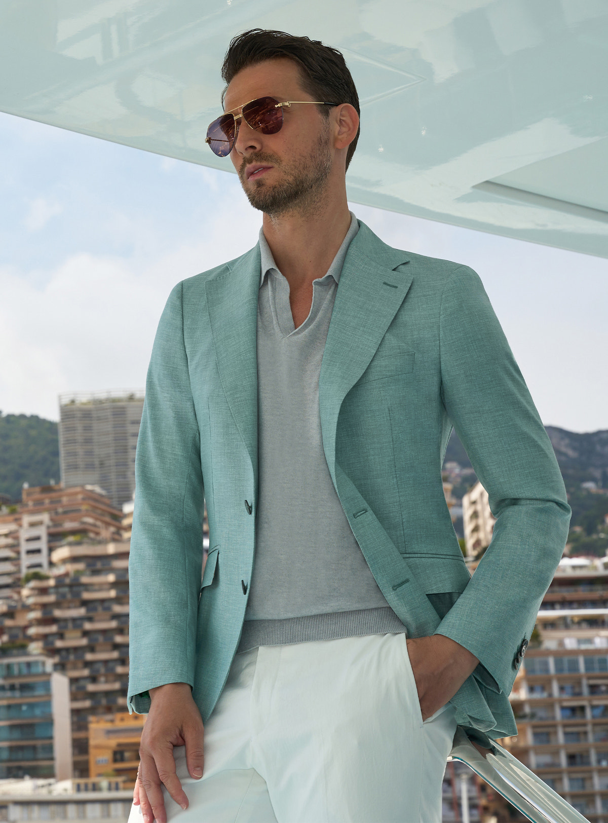 Mint green Consiglieri jacket with a light polo shirt and white trousers