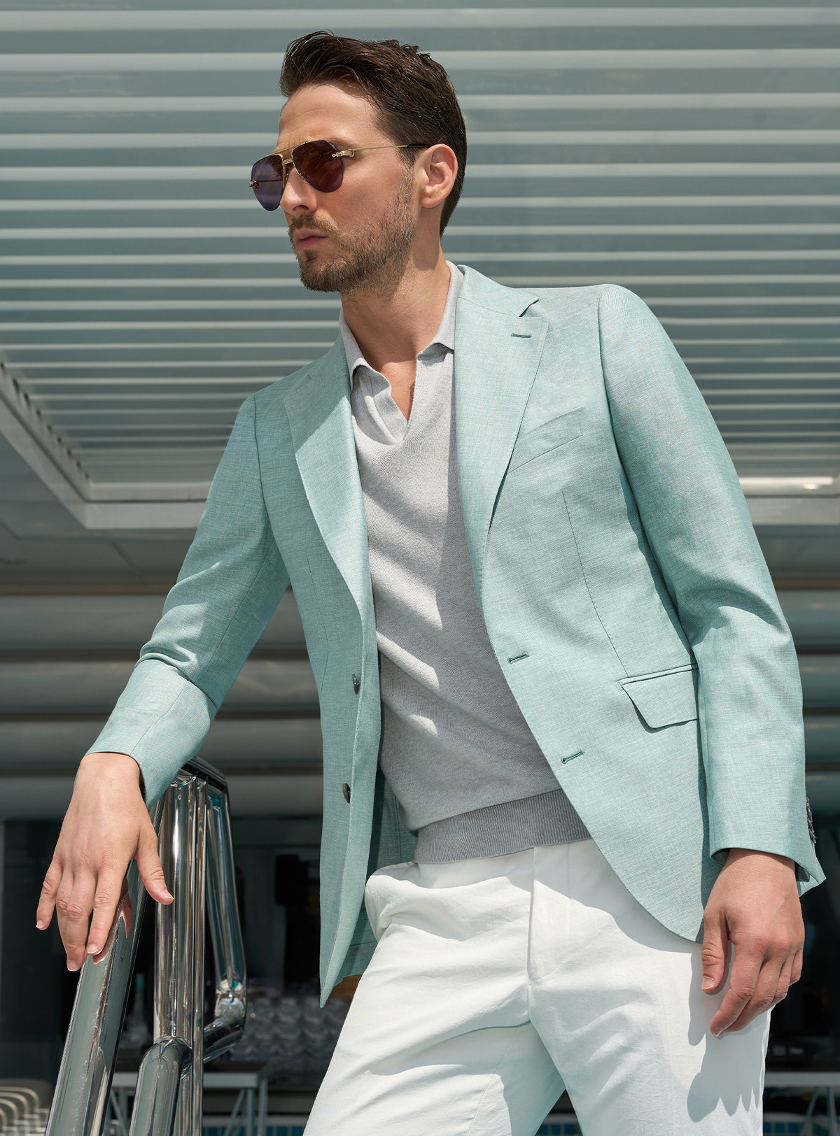 Mint green Consiglieri jacket with a light polo shirt and white trousers