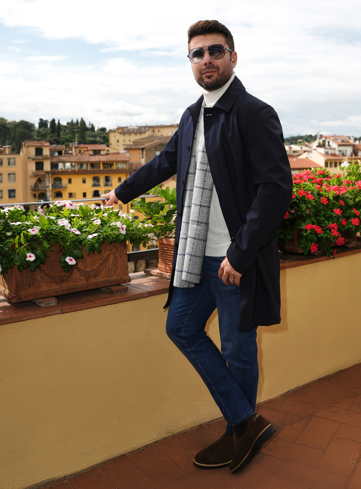 Blue Consiglieri jeans worn with a navy coat with checked lining