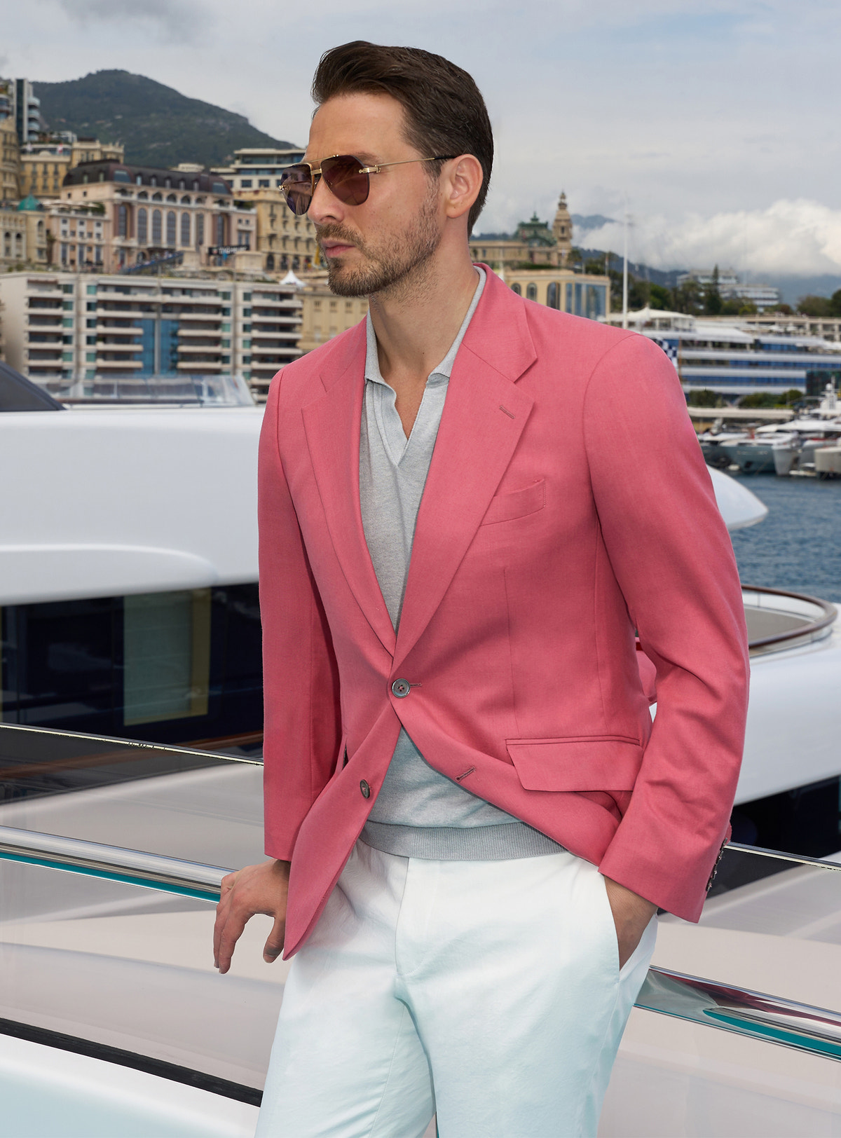 Pink Consiglieri jacket worn with an open-collar white shirt