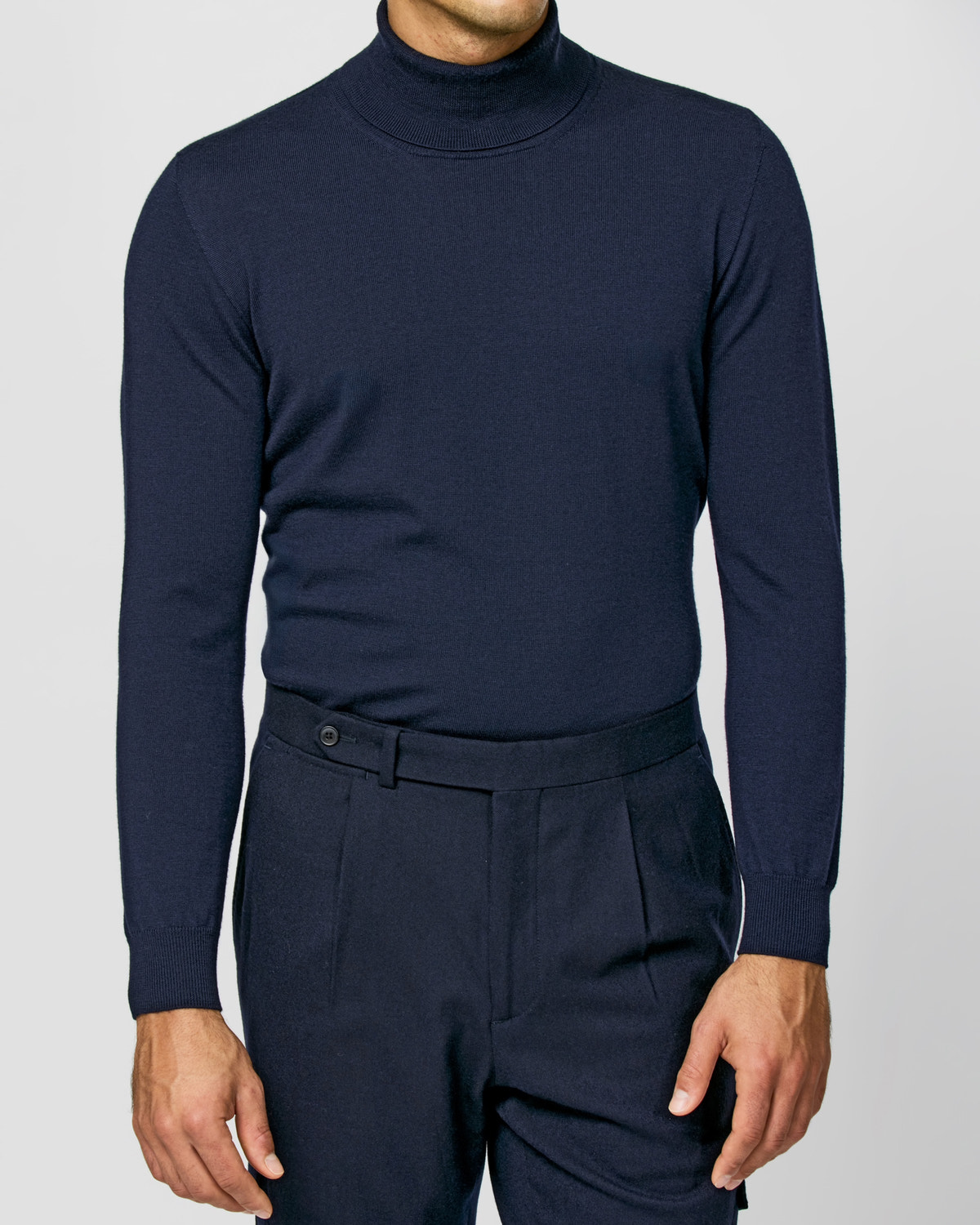 Navy Consiglieri turtleneck in a dark tonal ensemble