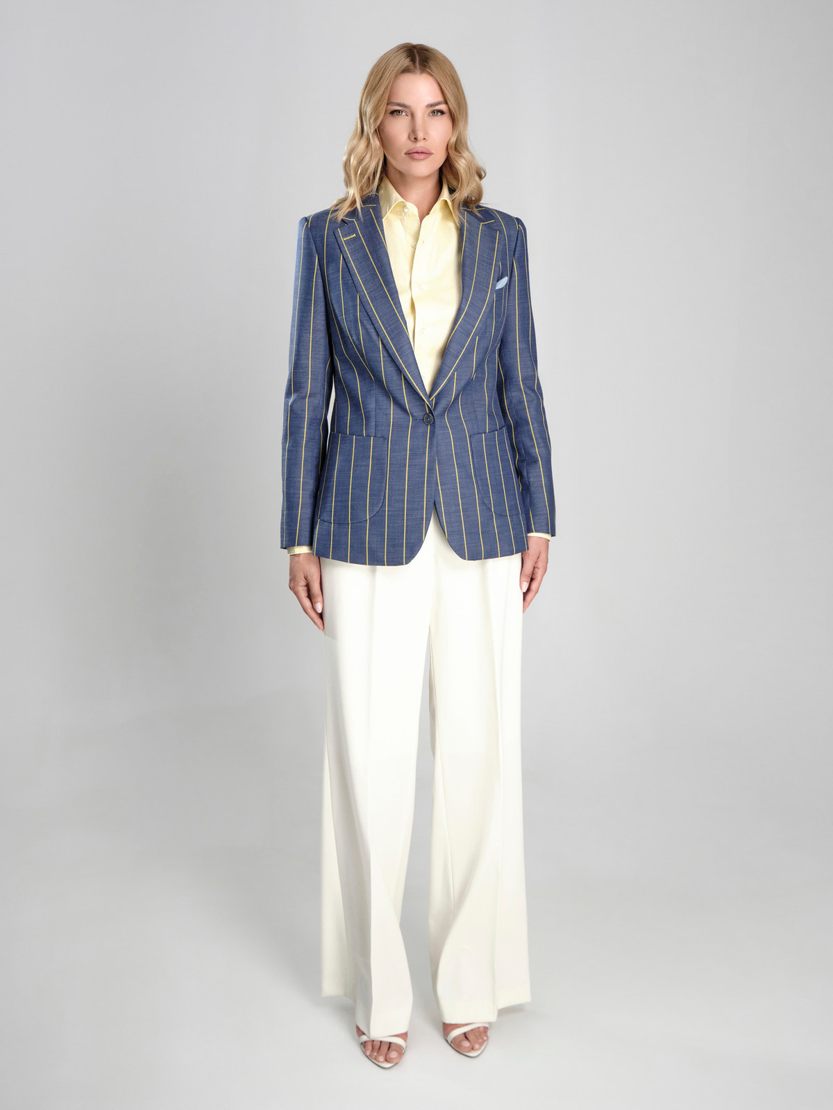 Blue Consiglieri DONNA blazer with contrasting stripes, a pale yellow shirt and white trousers