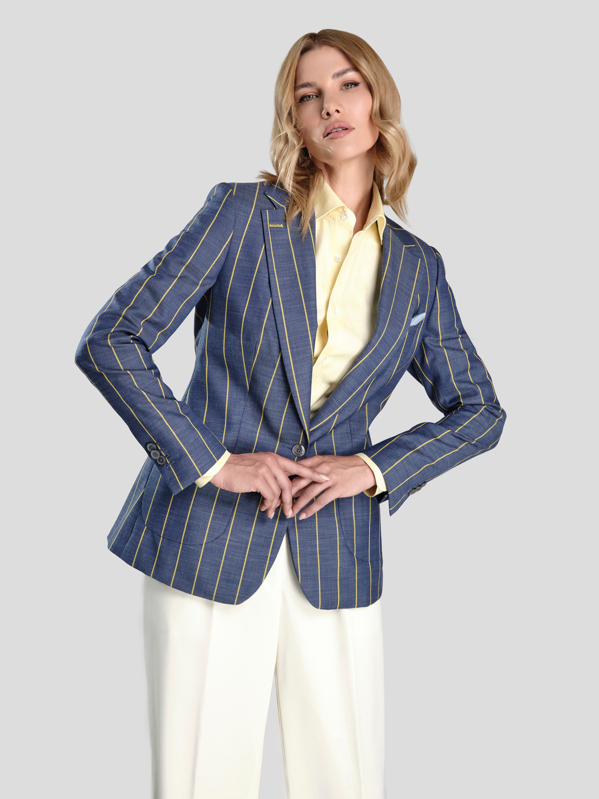 Blue Consiglieri DONNA blazer with contrasting stripes, a pale yellow shirt and white trousers