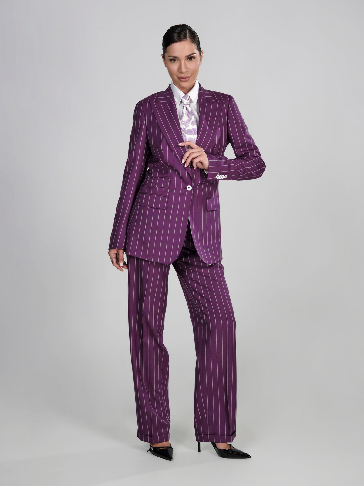Purple pinstriped Consiglieri DONNA women's suit worn with a patterned shirt
