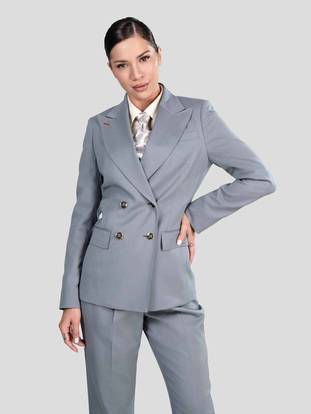 Grey Consiglieri DONNA double-breasted blazer with peak lapels over a patterned shirt
