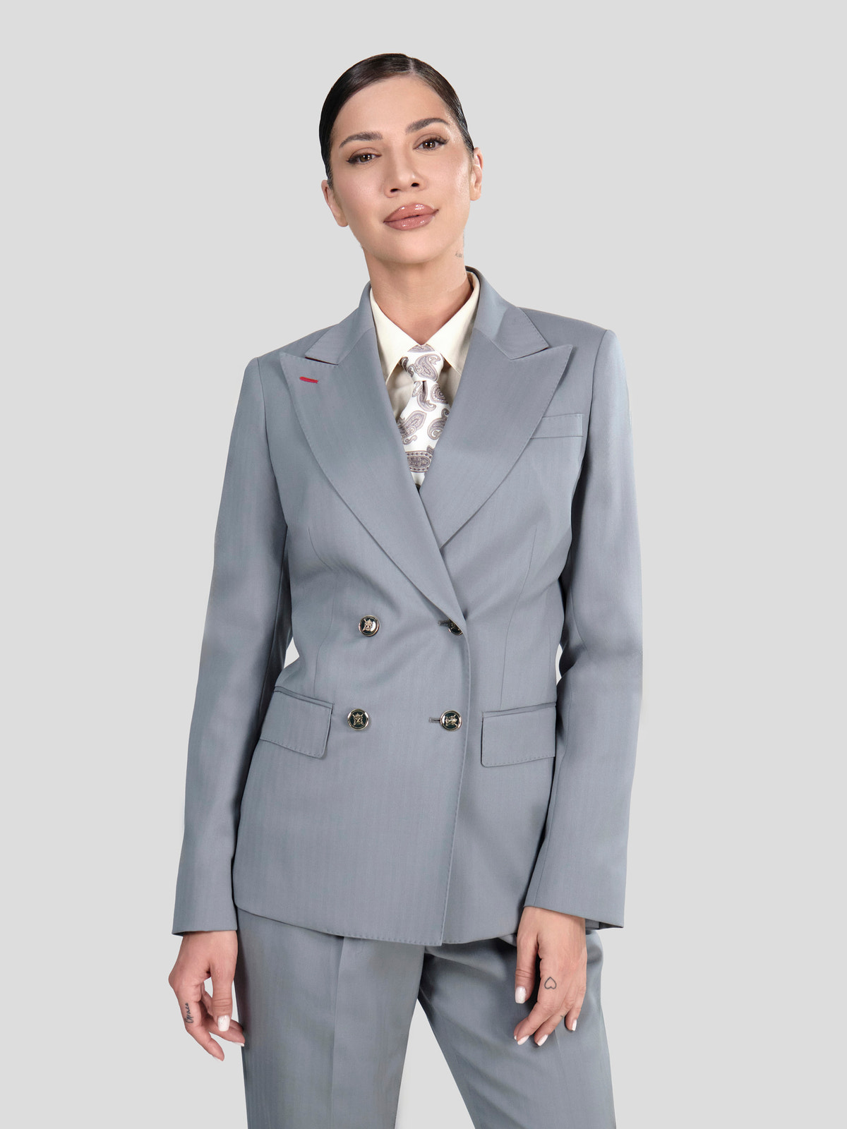 Grey Consiglieri DONNA double-breasted blazer with peak lapels over a patterned shirt