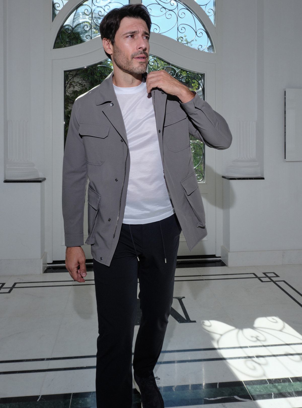 Grey Consiglieri patch-pocket jacket with a white T-shirt and black trousers