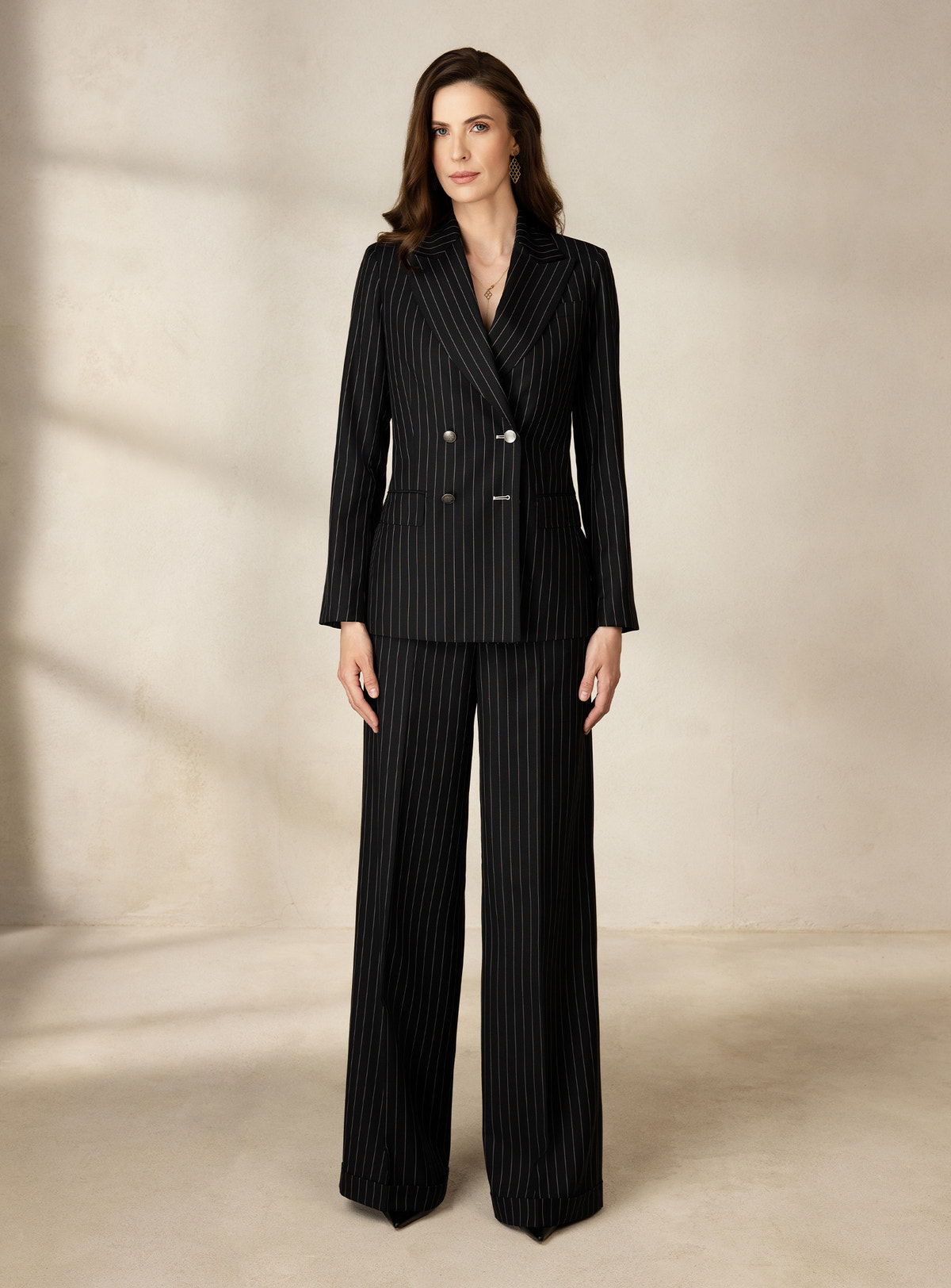 Black pinstriped Consiglieri DONNA suit with a double-breasted blazer and wide-leg trousers