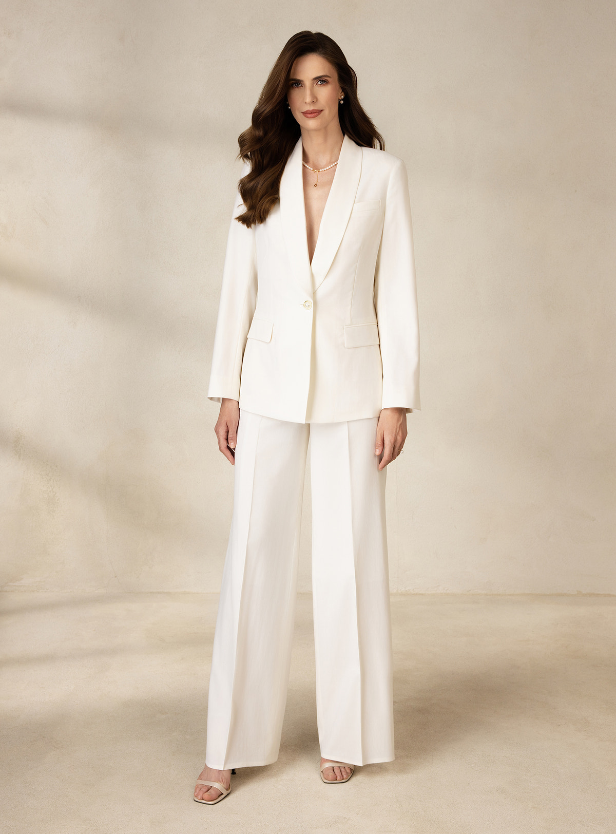 Ivory Consiglieri DONNA suit with a fitted shawl-lapel blazer and wide-leg trousers