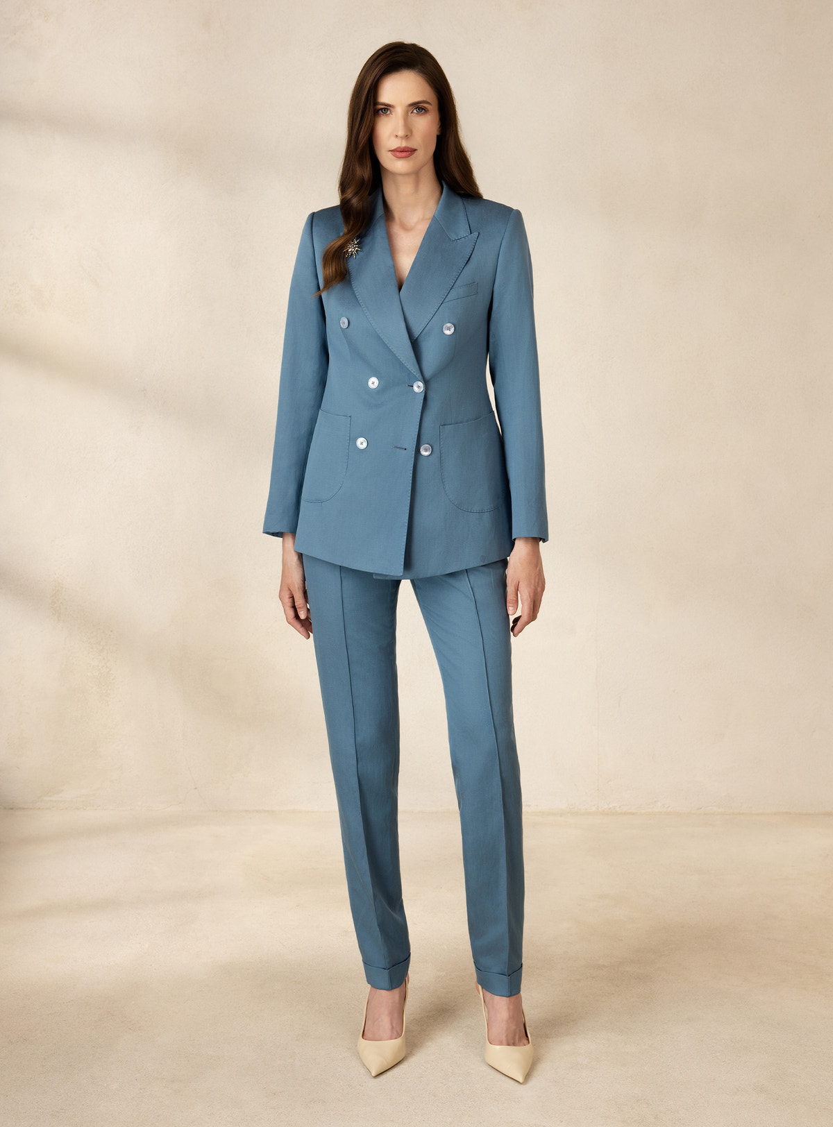 Blue Consiglieri DONNA suit with a white-button double-breasted blazer and tapered trousers
