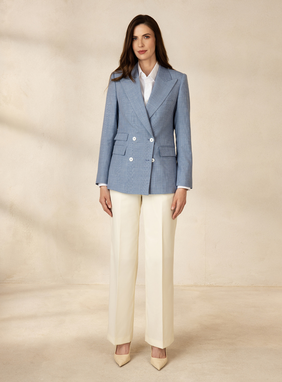 Pale blue Consiglieri DONNA double-breasted blazer with white buttons and cream trousers
