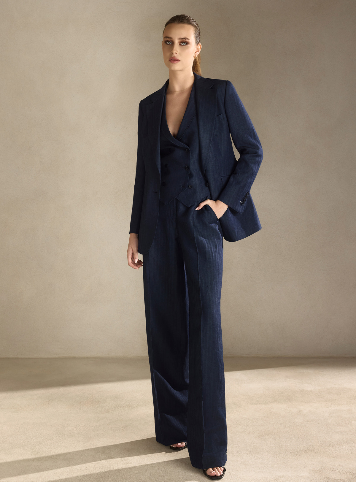 Navy three-piece Consiglieri DONNA suit with a fitted blazer, waistcoat and wide-leg trousers
