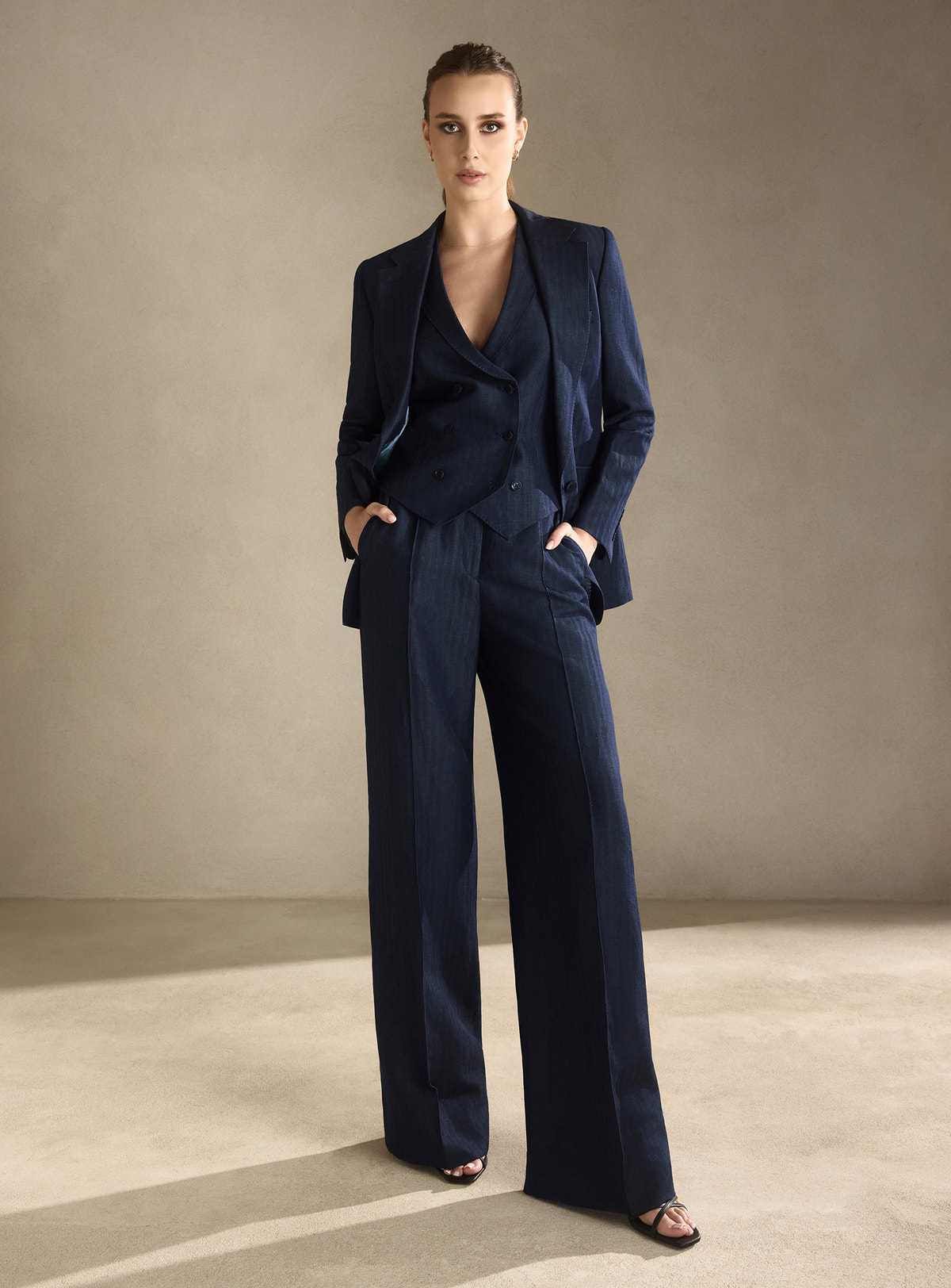 Navy three-piece Consiglieri DONNA suit with a fitted blazer, waistcoat and wide-leg trousers