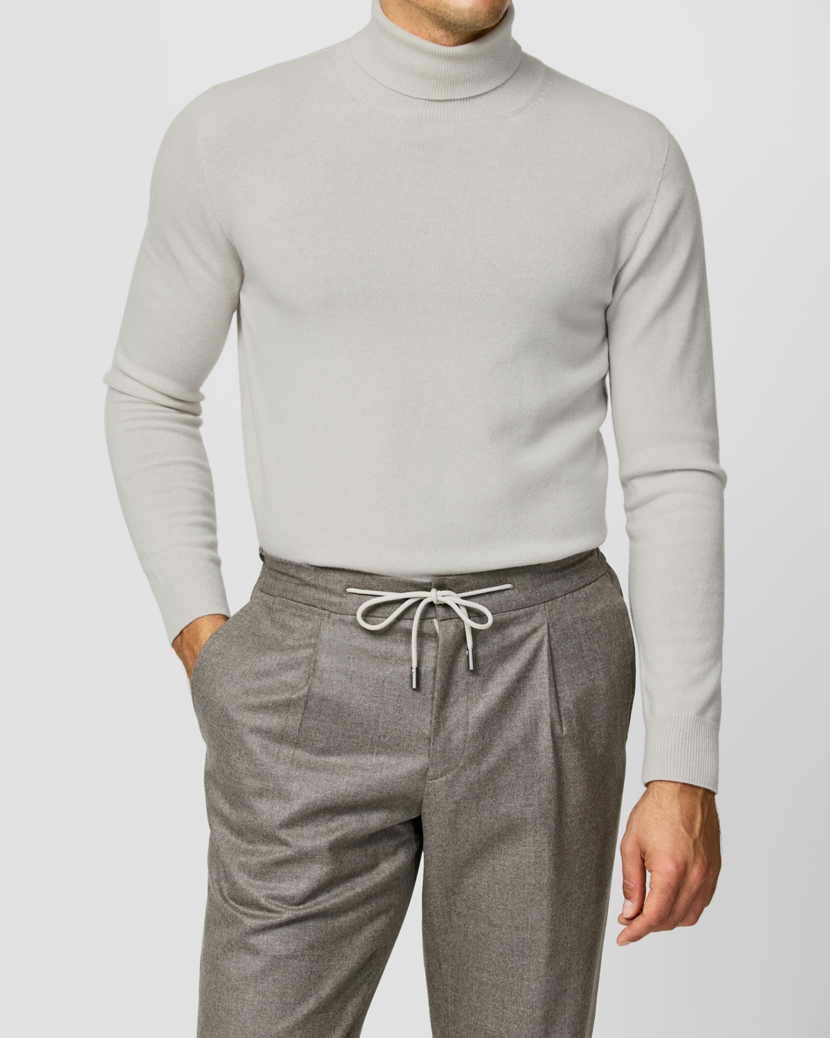 Light grey Consiglieri turtleneck worn with drawstring trousers