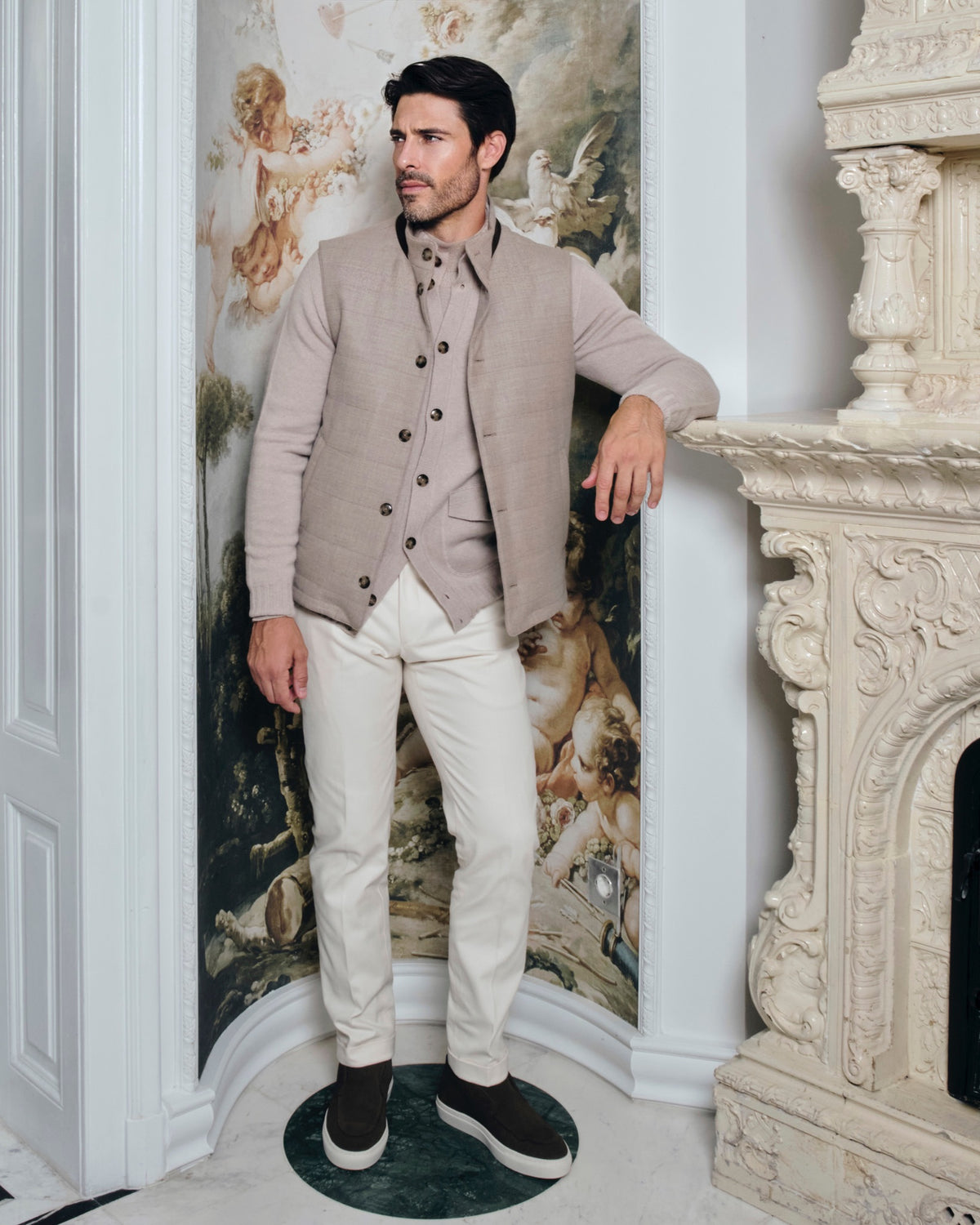Taupe Consiglieri cardigan with buttons and a stand collar, worn with white trousers