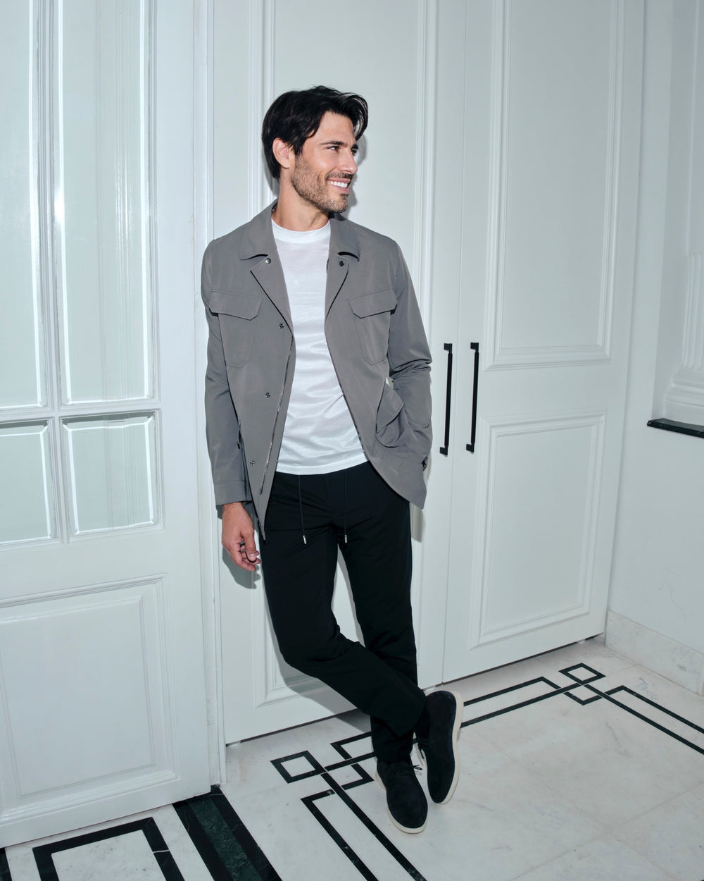 Grey Consiglieri jacket with patch pockets, worn with black trousers