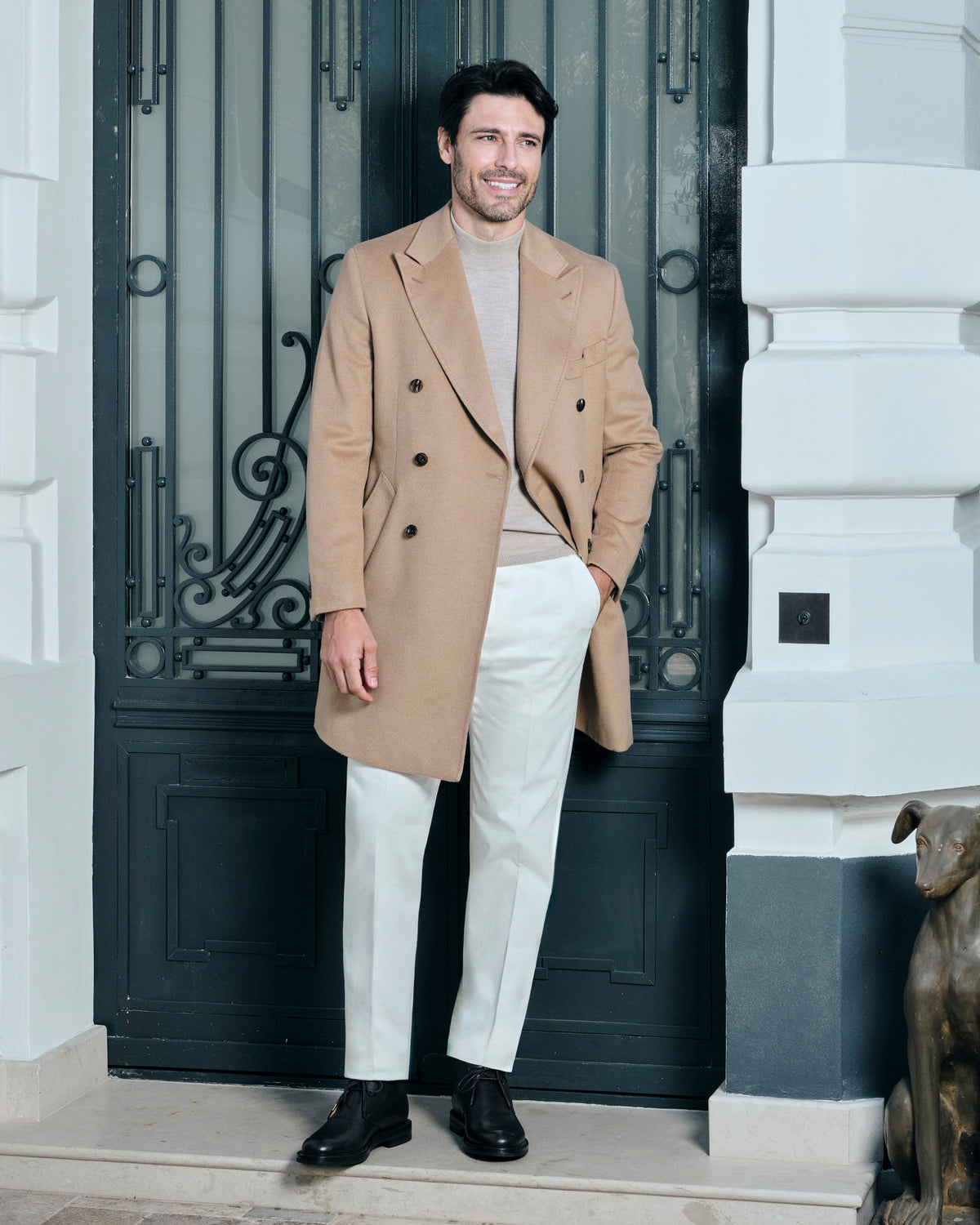 Camel double-breasted Consiglieri overcoat worn with cream trousers