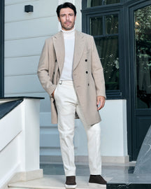 Light beige double-breasted Consiglieri overcoat with a light turtleneck and trousers