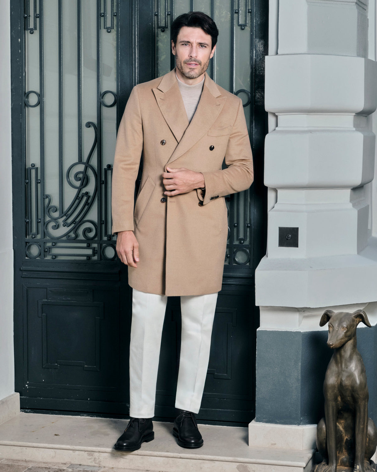 Camel double-breasted Consiglieri overcoat worn with cream trousers