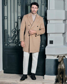 Camel double-breasted Consiglieri overcoat worn with cream trousers