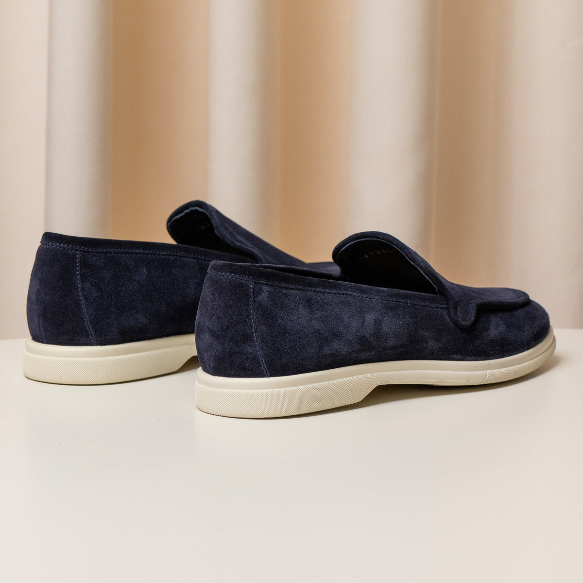 Consiglieri: heel and cream sole of the navy loafers