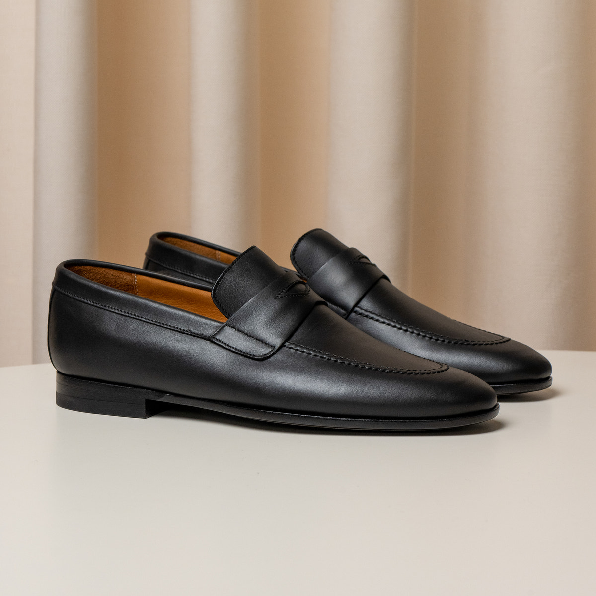 Consiglieri: black penny loafers with dark soles