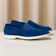 Consiglieri: rich blue loafers with a velvety texture and white soles