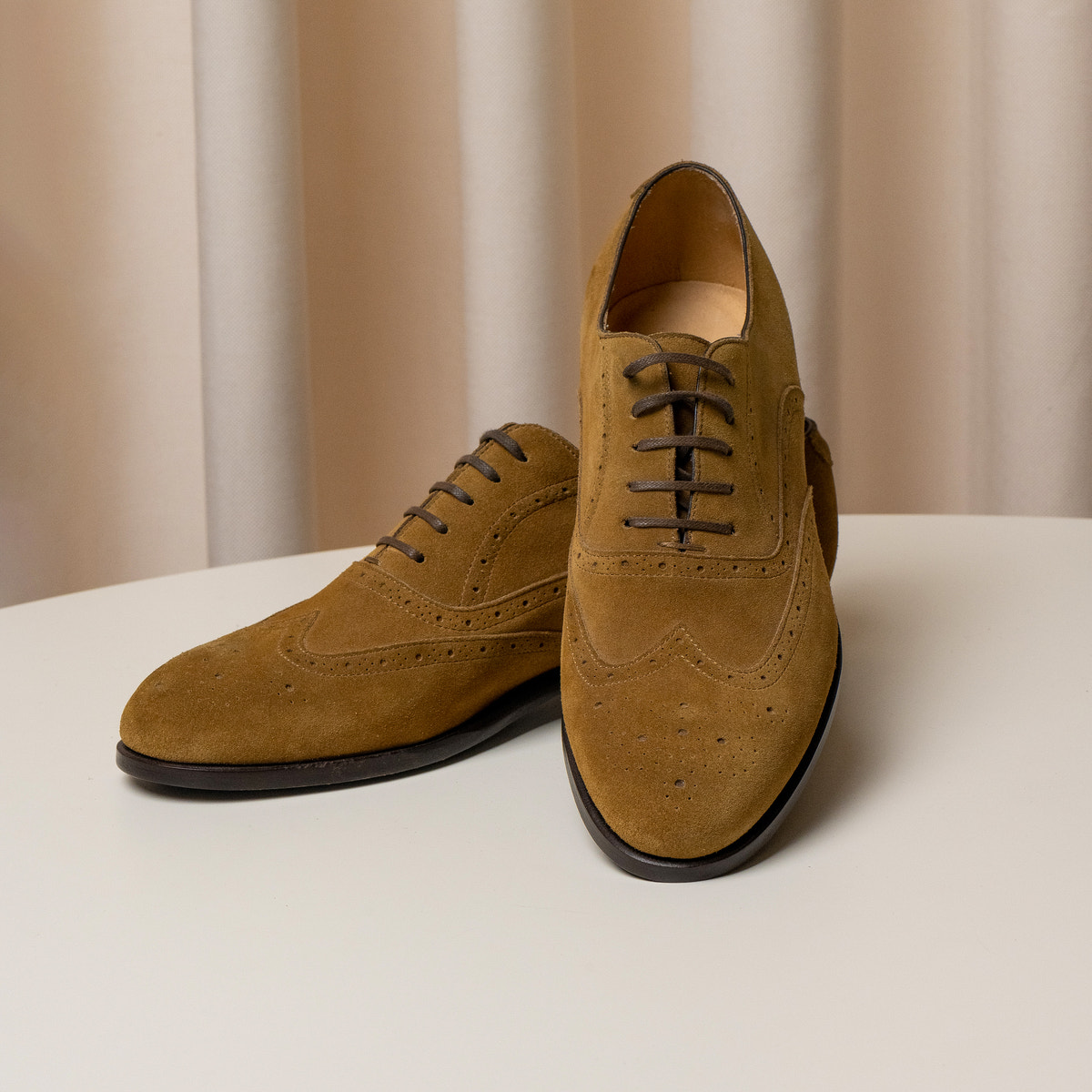 Consiglieri: laces and decorative broguing of the ochre Oxford shoes