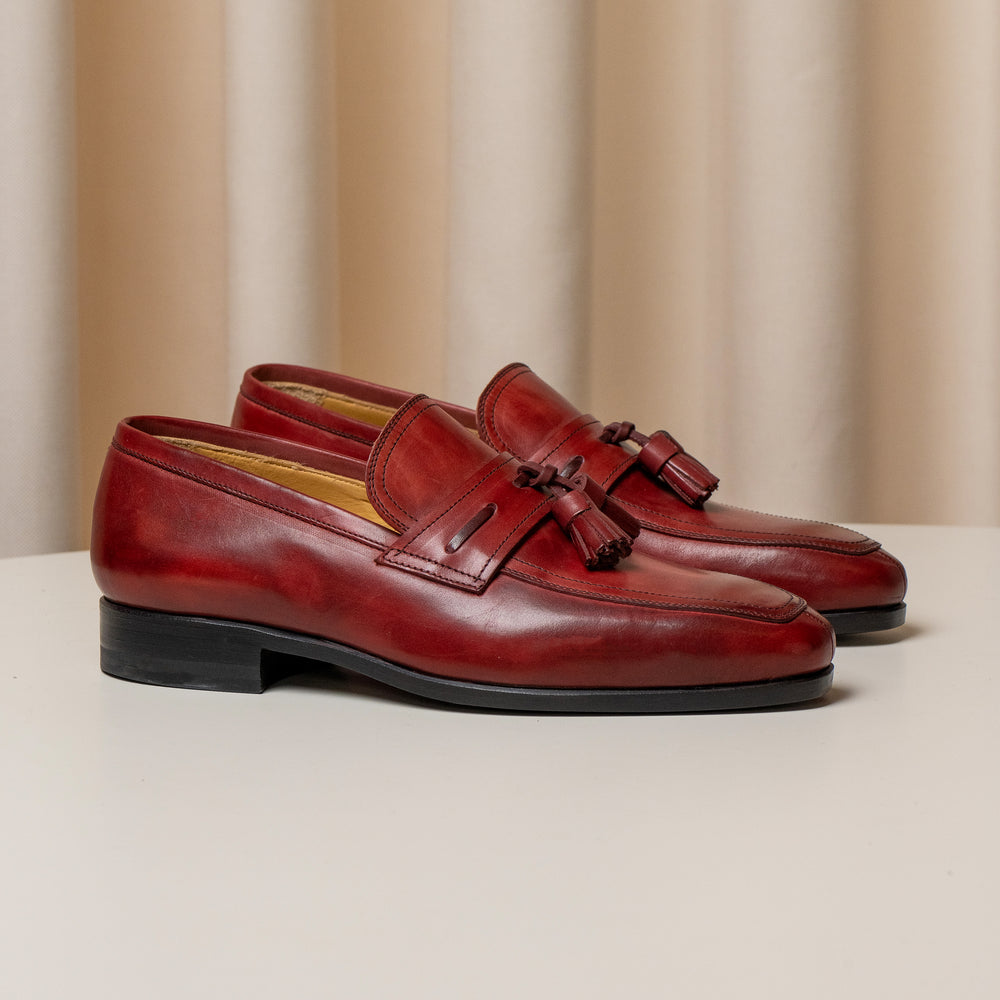 Consiglieri: deep red tassel loafers with a polished patina