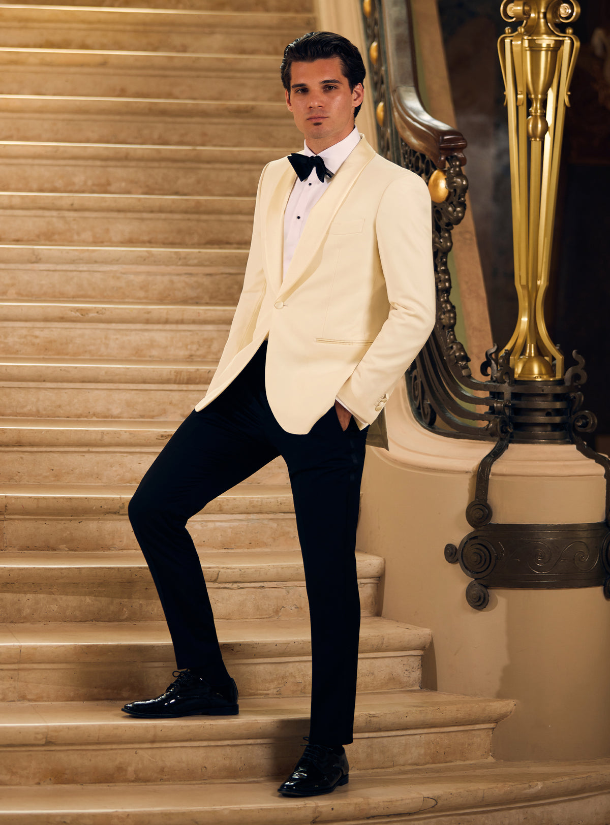 Consiglieri tuxedo with an ivory dinner jacket, black trousers and black bow tie