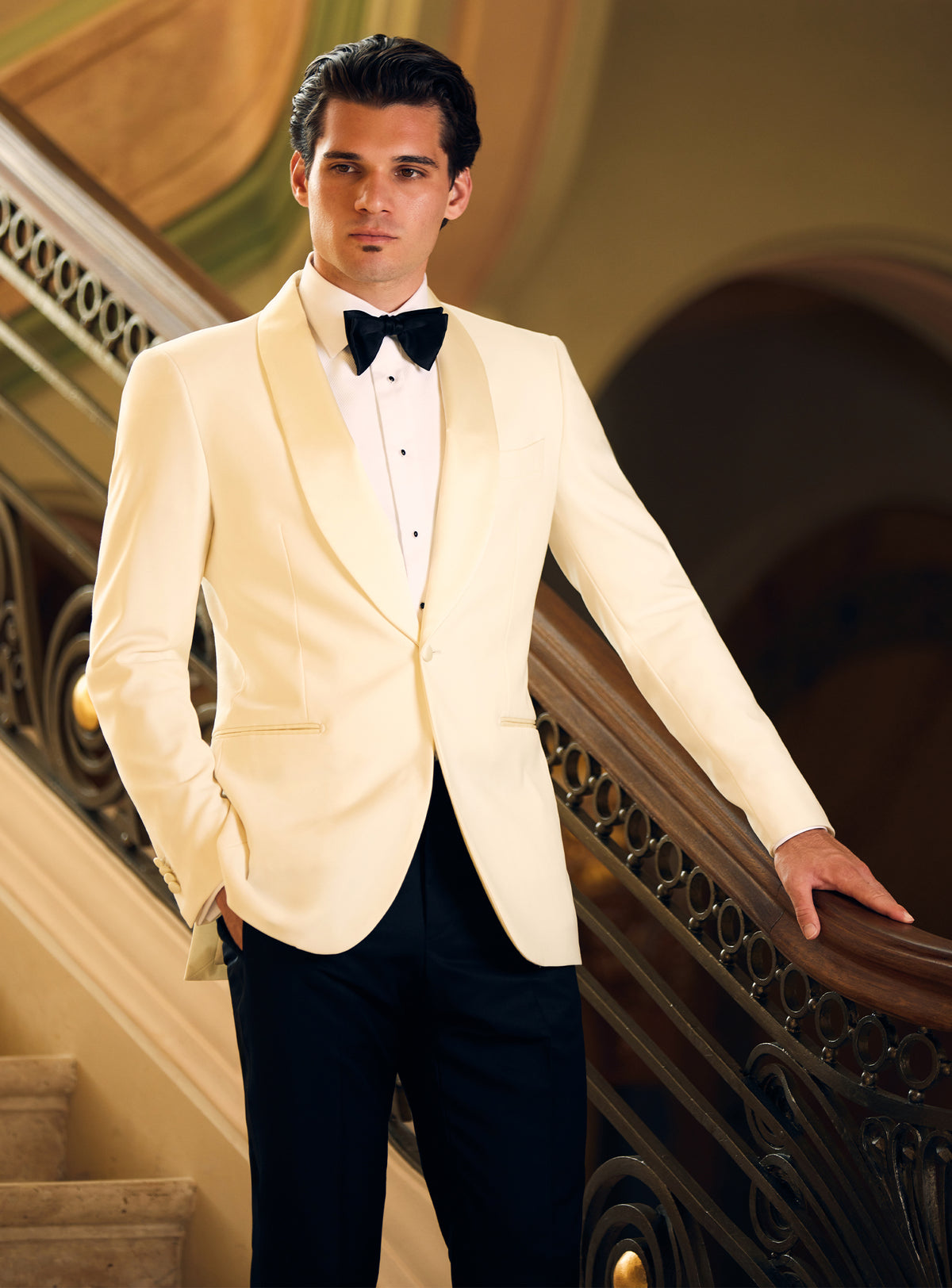 Consiglieri tuxedo with an ivory dinner jacket, black trousers and black bow tie