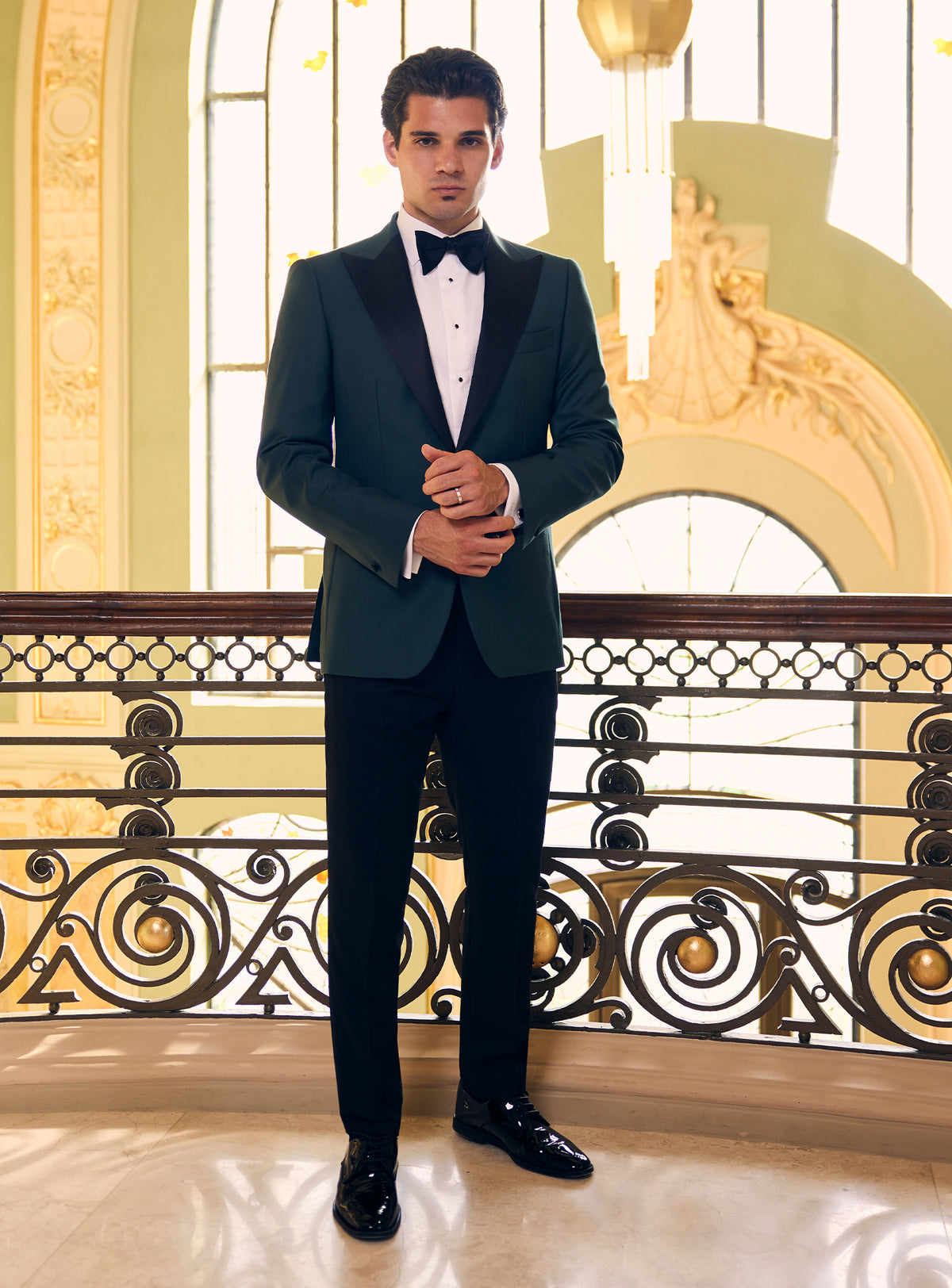 Consiglieri tuxedo with a dark green dinner jacket, black lapels and matching bow tie