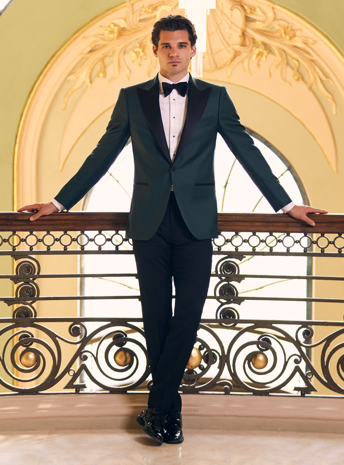 Consiglieri tuxedo with a dark green dinner jacket, black lapels and matching bow tie