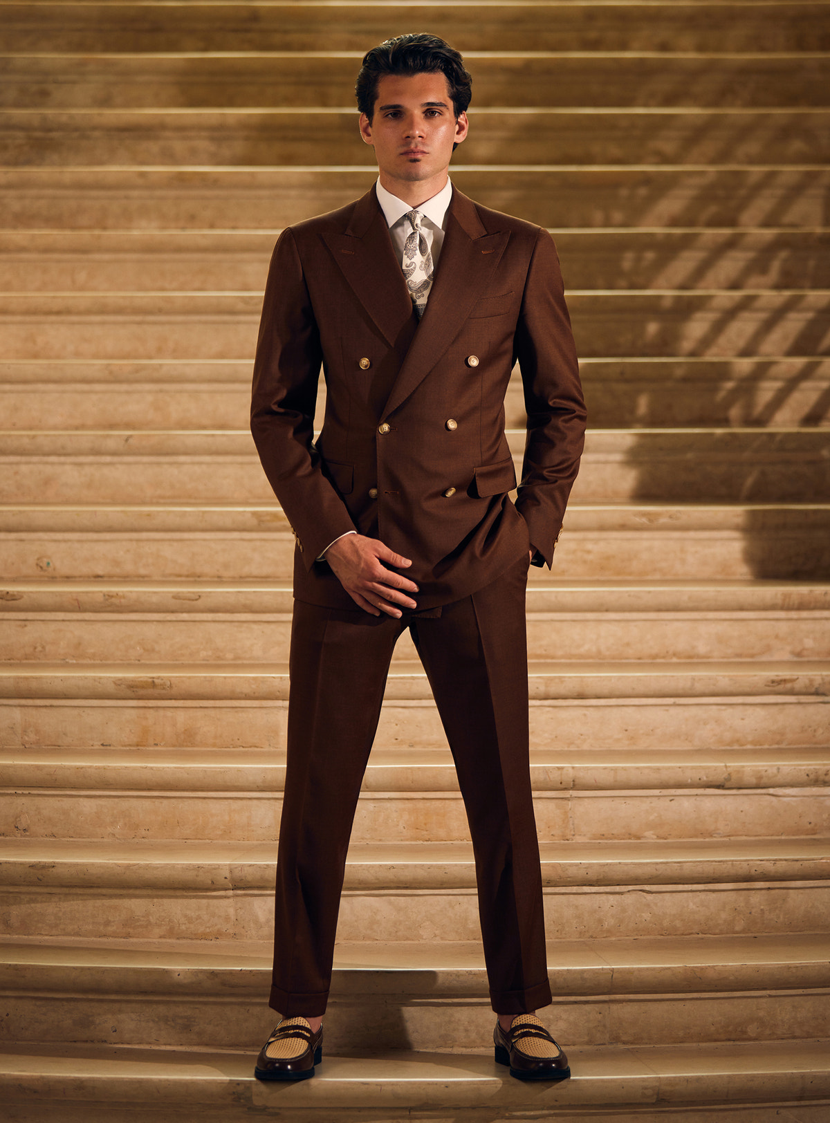 Dark brown double-breasted Consiglieri suit with a patterned tie