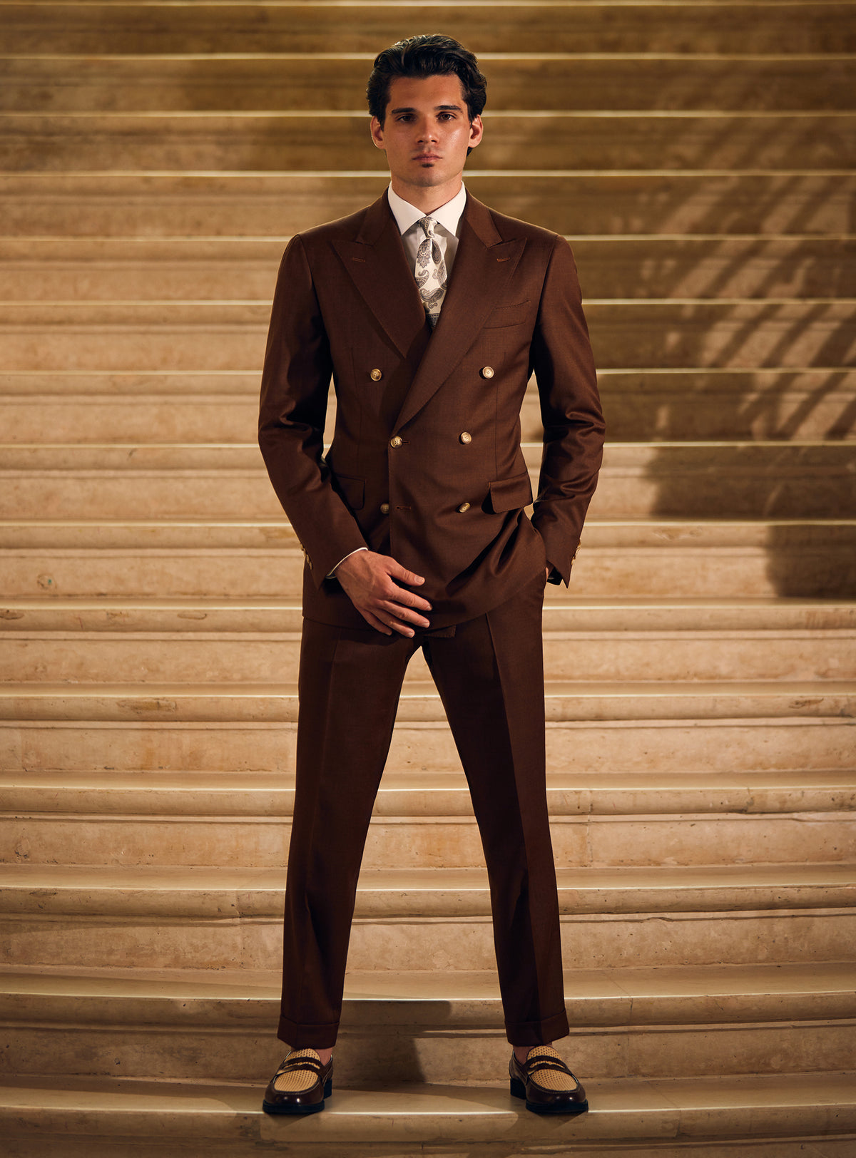 Dark brown double-breasted Consiglieri suit with a patterned tie