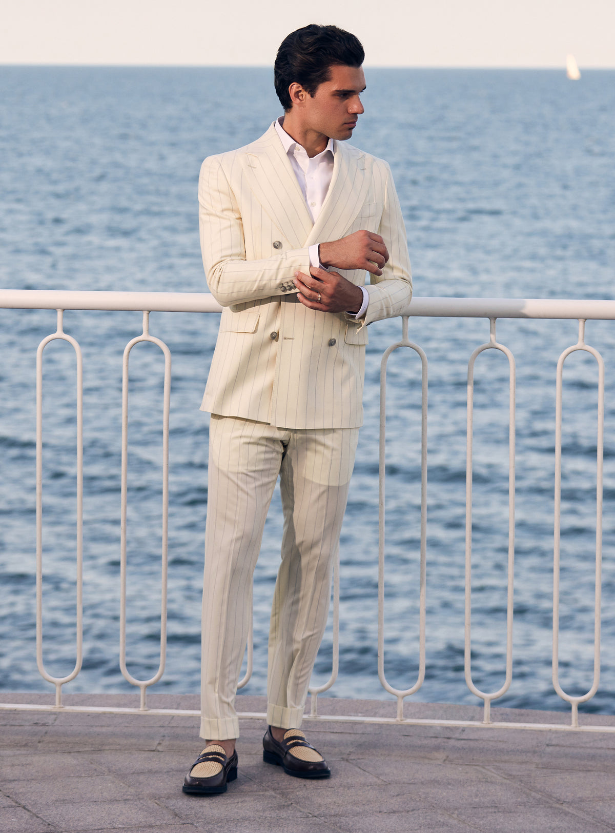 Cream pinstriped double-breasted Consiglieri suit worn with a white shirt