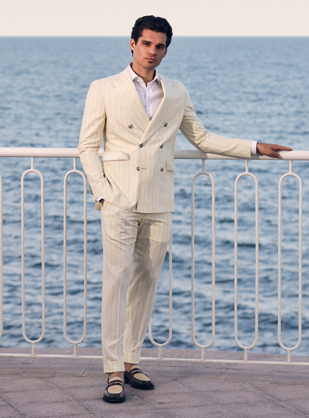 Cream pinstriped double-breasted Consiglieri suit worn with a white shirt