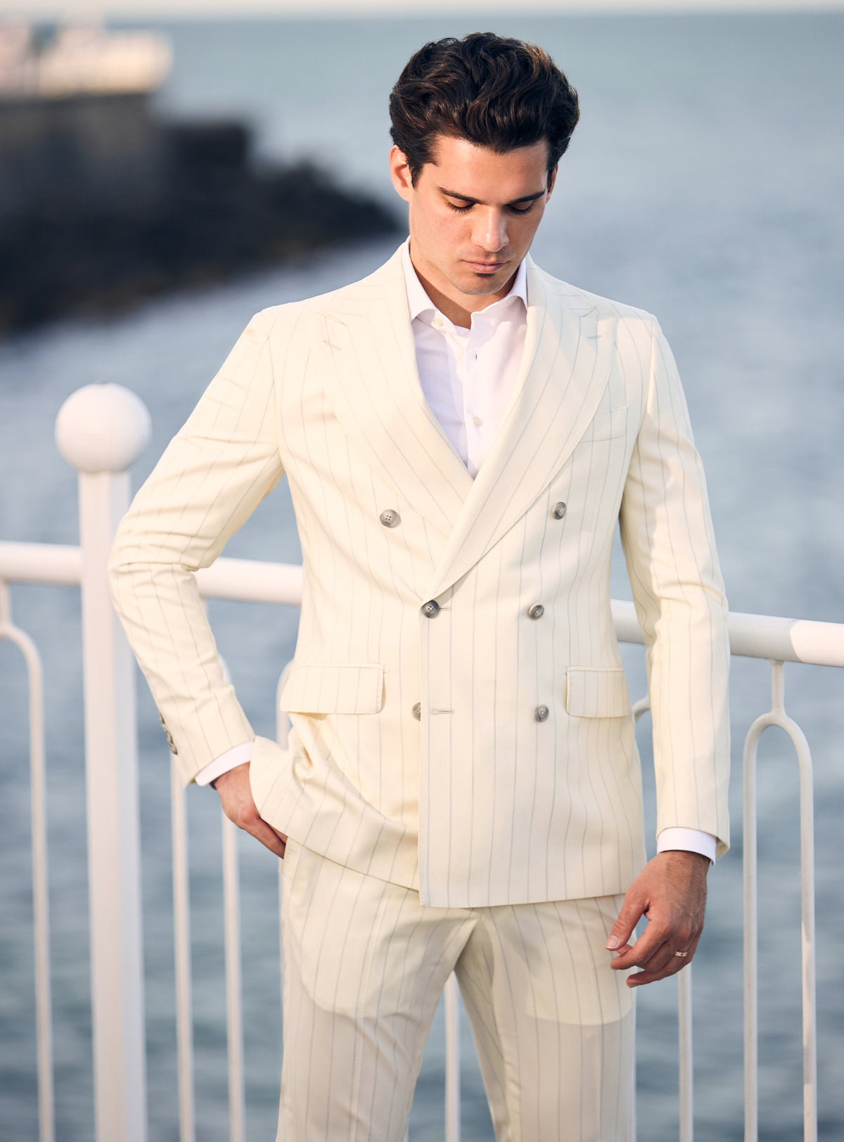 Cream pinstriped double-breasted Consiglieri suit worn with a white shirt