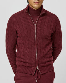 Burgundy cable-knit Consiglieri zip cardigan layered over a matching turtleneck