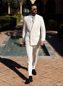 Ivory double-breasted Consiglieri suit worn with a white shirt