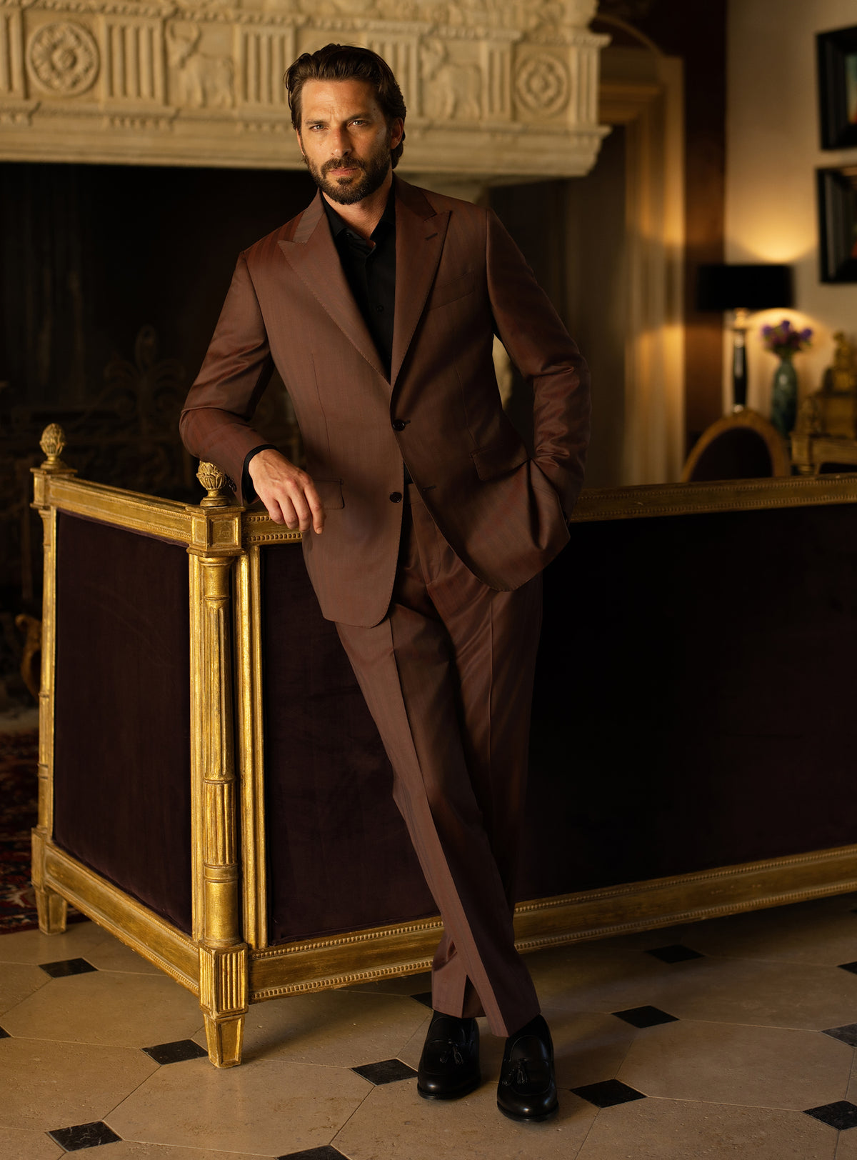 Brown Consiglieri suit worn with a black turtleneck and black loafers